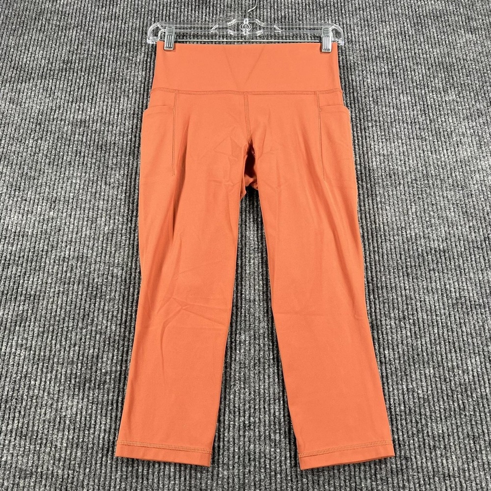 Athleta Leggings Womens Small Orange Salutation Stash Pocket Capri‎ Yoga Pants